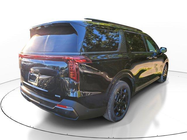 Photo of 2025 Aurora Black Pearl Kia Carnival Hybrid