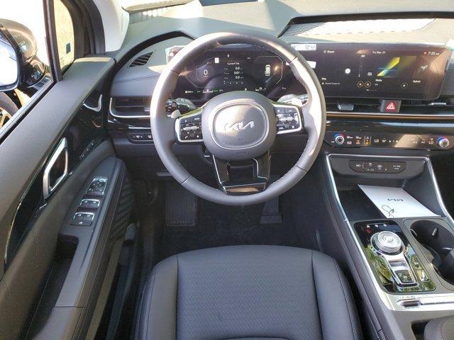 Photo of 2025 Aurora Black Pearl Kia Carnival Hybrid