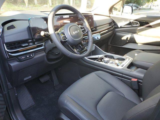 Photo of 2025 Aurora Black Pearl Kia Carnival Hybrid