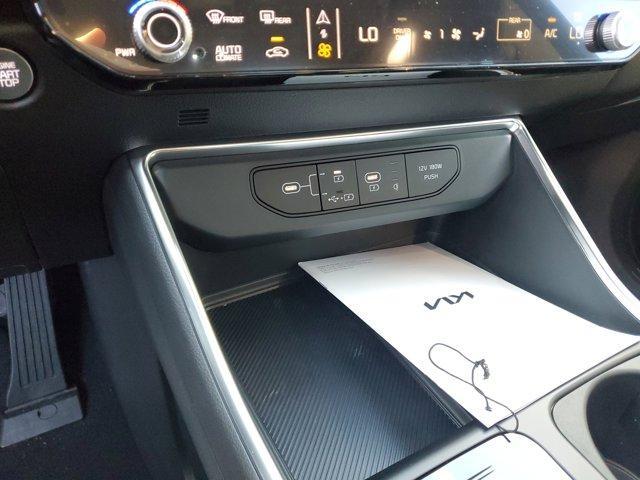 Photo of 2025 Aurora Black Pearl Kia Carnival Hybrid