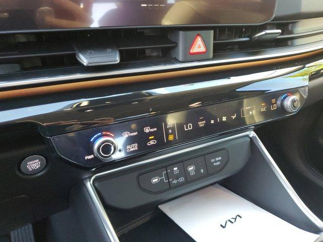 Photo of 2025 Aurora Black Pearl Kia Carnival Hybrid