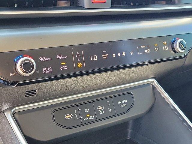 Photo of 2025 Ivory Silver Kia Carnival Hybrid