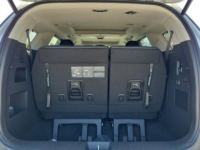 Photo of 2025 Ivory Silver Kia Carnival Hybrid