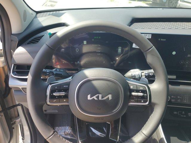 Photo of 2025 Ivory Silver Kia Carnival Hybrid