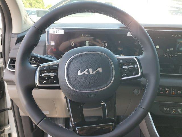 Photo of 2025 Ivory Silver Kia Carnival