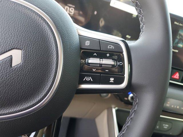 Photo of 2025 Ivory Silver Kia Carnival