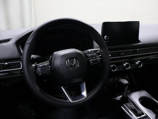 Photo of 2025 Boost Blue Pearl Honda Civic Hybrid