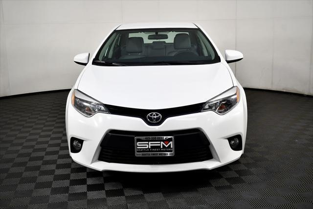 Photo of 2014 Super White Toyota Corolla