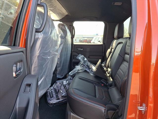 Photo of 2025 Afterburn Orange Nissan Frontier