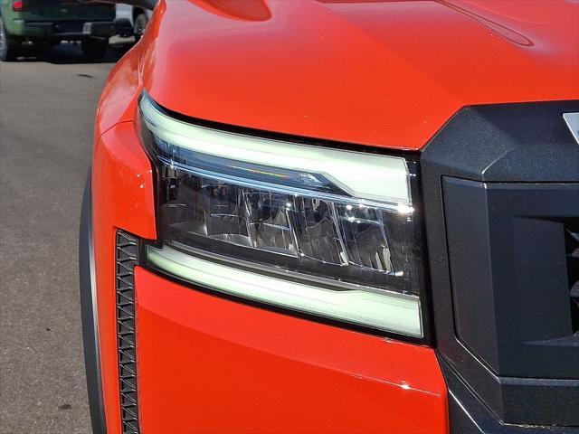 Photo of 2025 Afterburn Orange Nissan Frontier