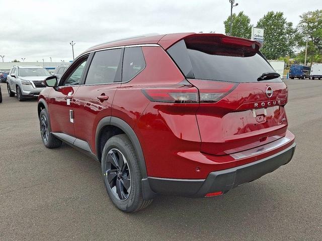 Photo of 2026 Scarlet Ember Tintcoat Nissan Rogue