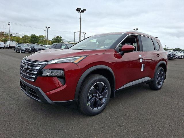 Photo of 2026 Scarlet Ember Tintcoat Nissan Rogue