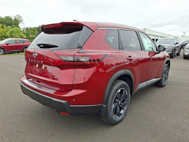 Photo of 2026 Scarlet Ember Tintcoat Nissan Rogue
