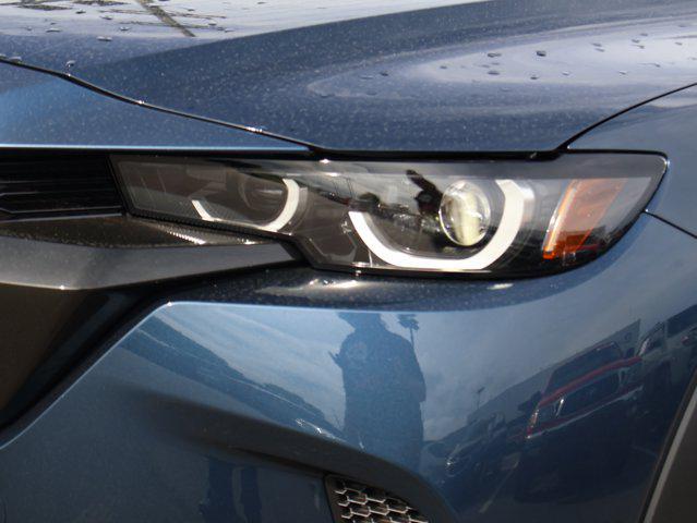 Photo of 2025 Ingot Blue Metallic Mazda CX-50 Hybrid