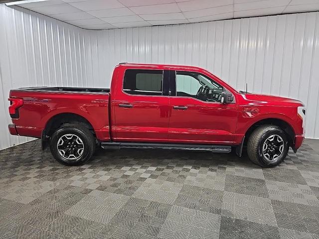 Photo of 2022 Red Metallic Ford F-150 Lightning