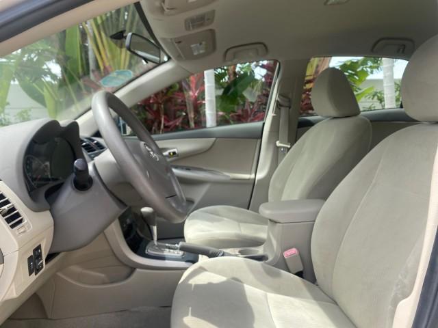 Photo of 2010 Desert Sand Mica Toyota Corolla