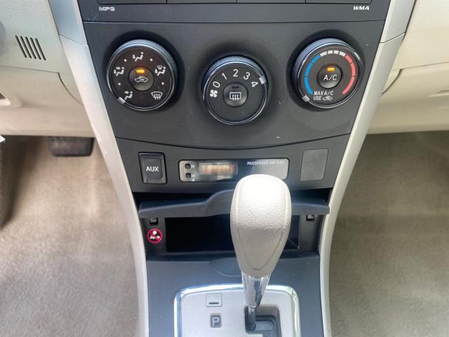 Photo of 2010 Desert Sand Mica Toyota Corolla