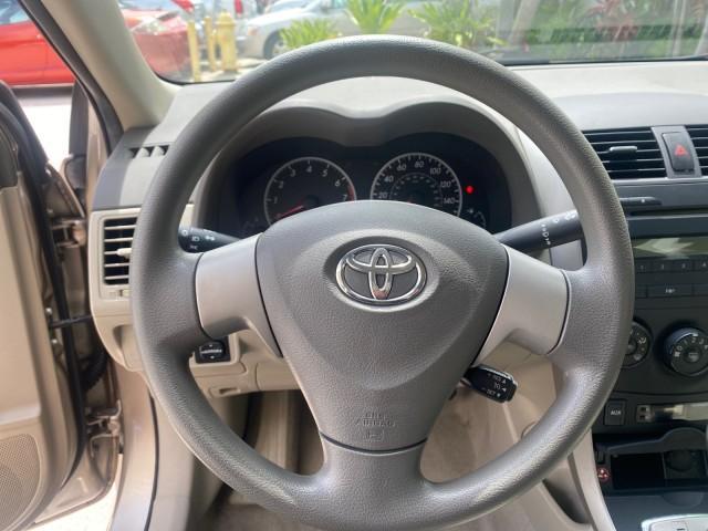 Photo of 2010 Desert Sand Mica Toyota Corolla