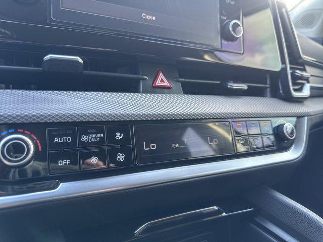 Photo of 2025 Fusion Black Kia Sportage Hybrid