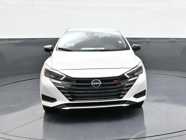 Photo of 2025 Aspen White Tricoat Nissan Versa