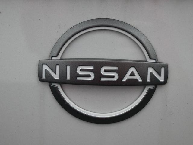Photo of 2025 Aspen White Tricoat Nissan Versa