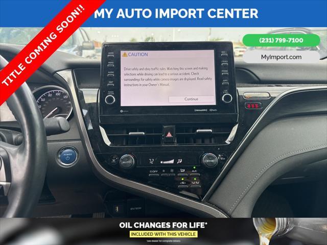 Photo of 2022 Wind Chill Pearl Toyota Camry Hybrid