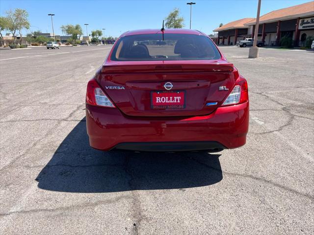 Photo of 2015 Red Brick Nissan Versa