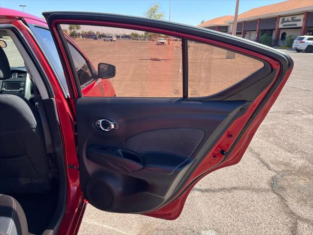 Photo of 2015 Red Brick Nissan Versa