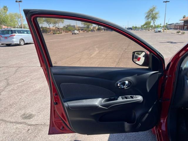 Photo of 2015 Red Brick Nissan Versa