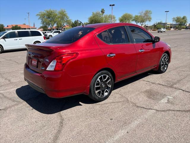 Photo of 2015 Red Brick Nissan Versa