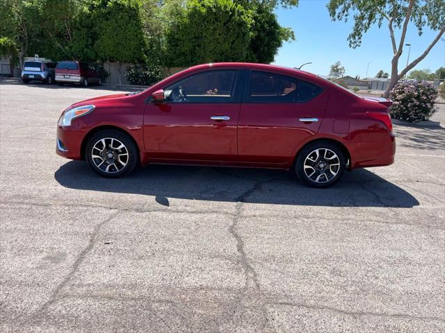 Photo of 2015 Red Brick Nissan Versa