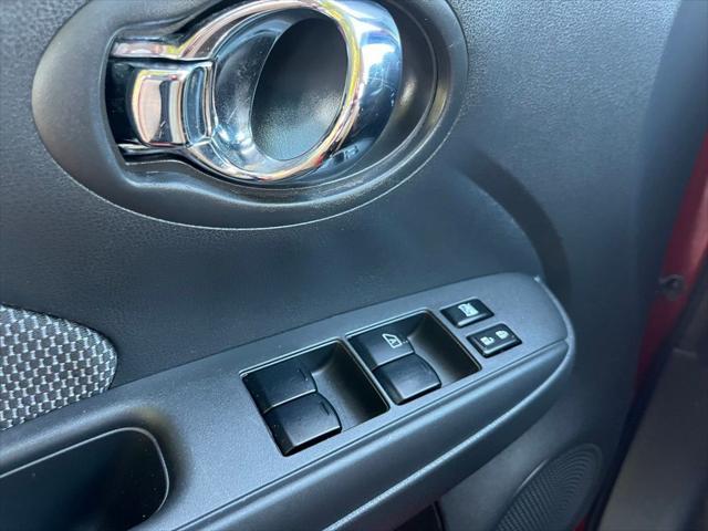 Photo of 2015 Red Brick Nissan Versa