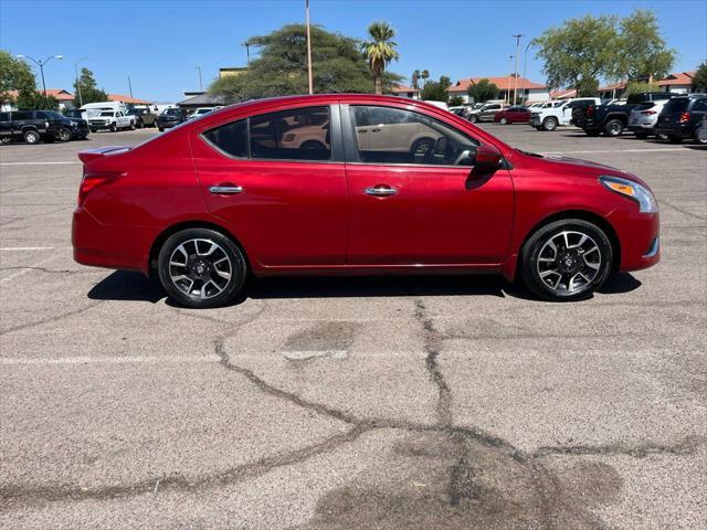 Photo of 2015 Red Brick Nissan Versa