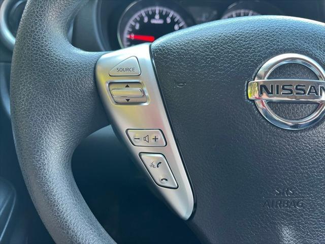 Photo of 2015 Red Brick Nissan Versa