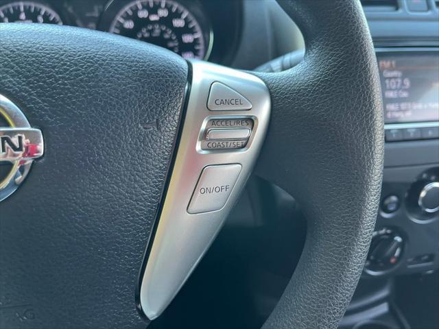 Photo of 2015 Red Brick Nissan Versa