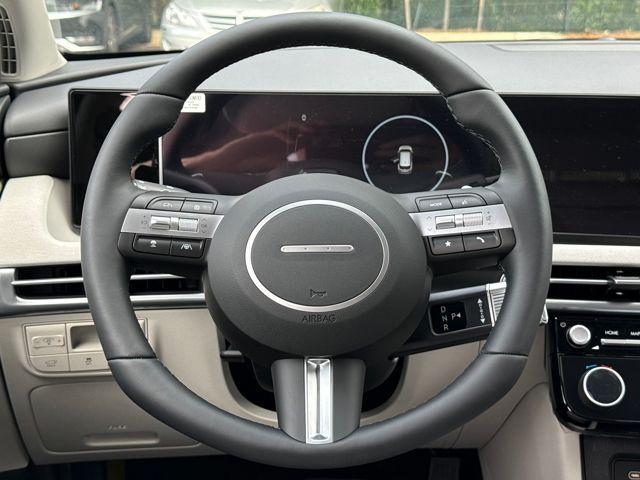 Photo of 2025 White Pearl Hyundai TUCSON Hybrid
