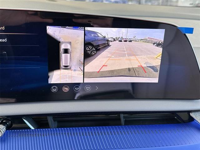 Photo of 2025 Crystal White Tri-Coat Cadillac OPTIQ