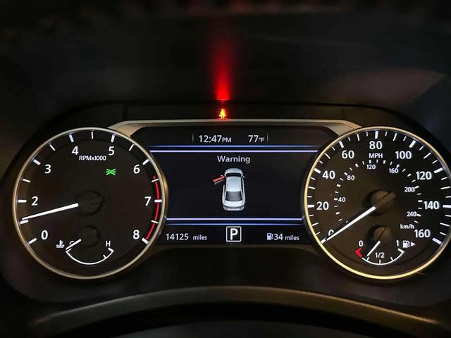 Photo of 2024 Aspen White Tricoat Nissan Sentra