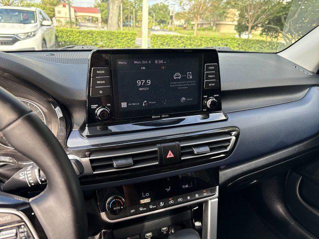 Photo of 2023 Starbright Yellow/Black Roof Kia Seltos