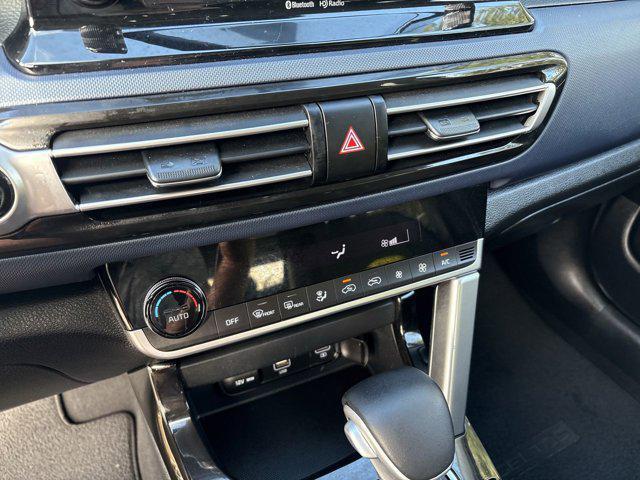 Photo of 2023 Starbright Yellow/Black Roof Kia Seltos