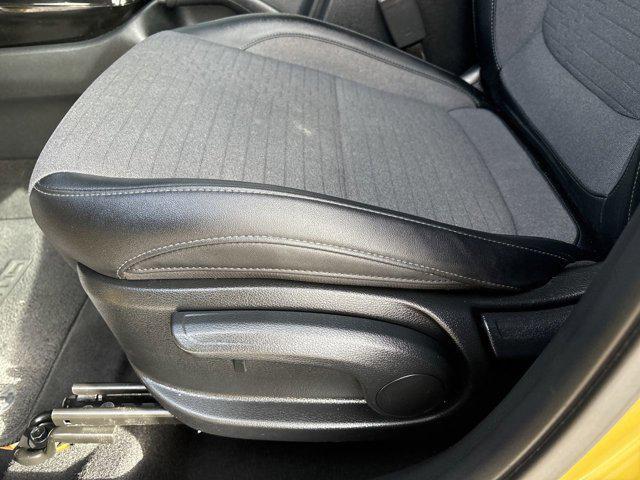 Photo of 2023 Starbright Yellow/Black Roof Kia Seltos