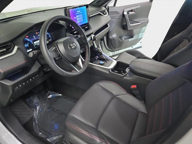 Photo of 2025 Wind Chill Pearl/Midnight Black Metallic Toyota RAV4 Hybrid