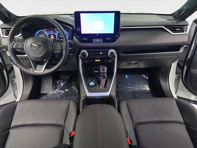 Photo of 2025 Wind Chill Pearl/Midnight Black Metallic Toyota RAV4 Hybrid
