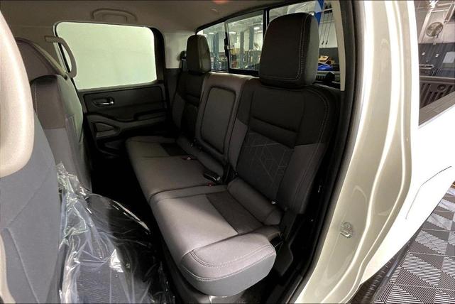 Photo of 2025 Glacier White Nissan Frontier