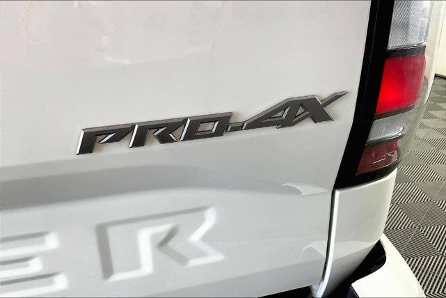 Photo of 2023 Glacier White Nissan Frontier