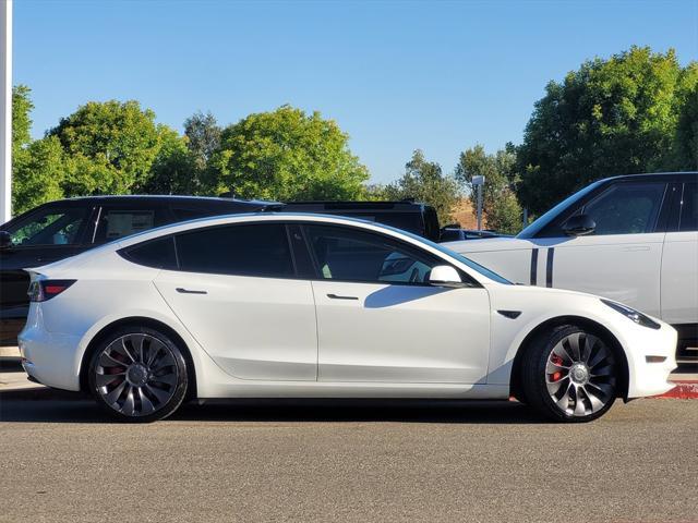 Photo of 2022 Pearl White Multi-Coat Tesla Model 3