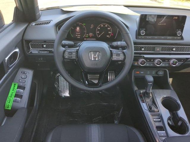 Photo of 2025 Solar Silver Metallic Honda Civic Hybrid