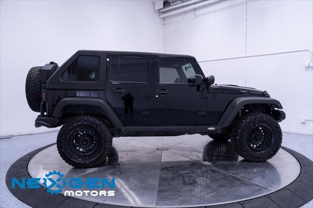 Photo of 2011 Black Clearcoat Jeep Wrangler Unlimited