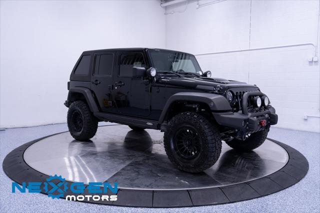 Photo of 2011 Black Clearcoat Jeep Wrangler Unlimited