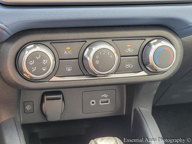 Photo of 2025 Aspen White Tricoat Nissan Versa